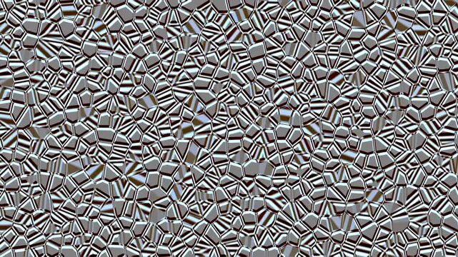 Metallic Tessellation: A mesmerizing pattern of interlocking metallic shapes creates a textured, abstract surface, suggesting a futuristic material or a close-up view of a complex industrial design.