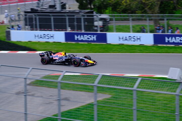 Obraz premium May 24, 2025, Montreal, Canada: Red Bull Racing Formula 1 car during by Hadjar or Verstappen, demonstration run at Circuit Gilles Villeneuve. g.