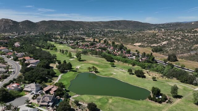 Aerial view of Ramona neighborhood with mountain, valley and San Vicente Golf Course, in California, USA