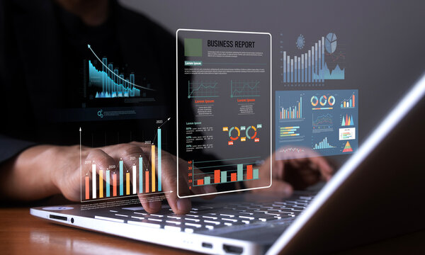 Reviewing business report on digital Labtop.