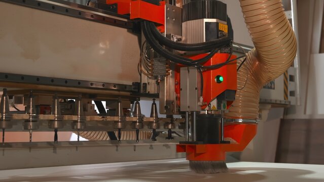 Automated Tool Swapping System Efficiently Manages Router Bits During Rapid Panel Manufacturing Processes . Media