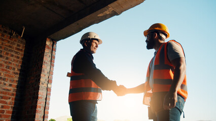 Meeting, building and men with handshake on construction site for agreement, compliance and...