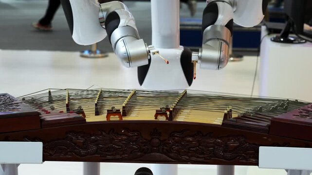 Robotic Arms Playing Traditional String Instrument at Technology Exhibition