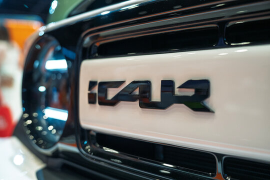 Penang, Malaysia - May 02, 2026: A close-up detailed shot of the front fascia of a Chery iCAR V23 electric vehicle, highlighting the black embossed "iCAR" wordmark logo on a white panel.
