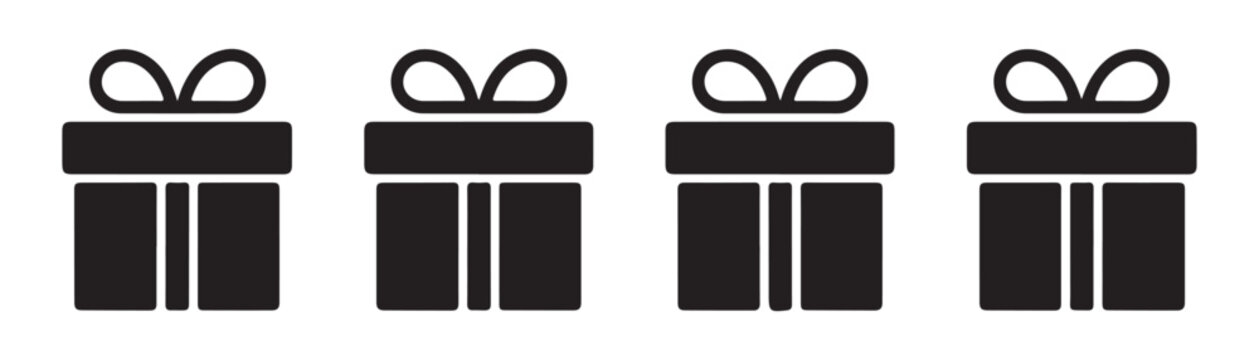 Four filled gift box icons with ribbons and bows on transparent background solid black.