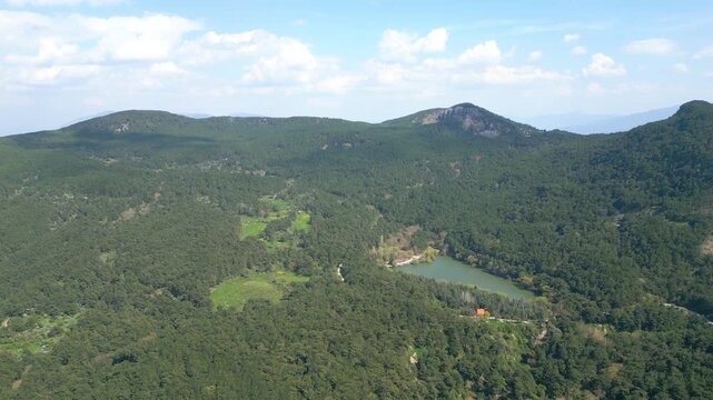 Aerial View of Karagol Lake Surrounded by Dense Green Pine Forest in Izmir Turkey. High quality 4k footage