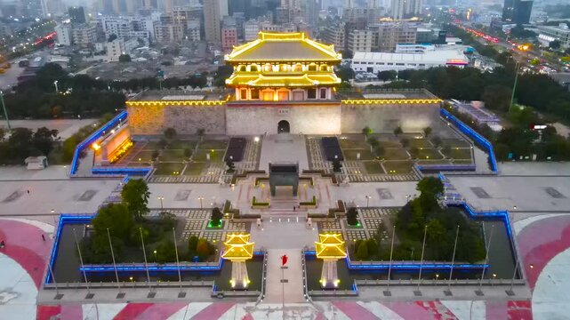 Illuminated Ancient City Gate and Wall at Dusk in Xi'an, China