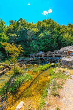 Traditional wooden watermills on the Krupa river waterfalls, a scenic rural landscape near Banja Luka, Bosnia and Herzegovina.