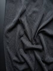 Fototapeta premium Dark-textured athletic mesh fabric details are showcased