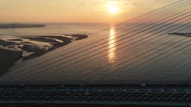 Aerial view of the modern Danjiang Bridge in Tamsui at sunset , New Taipei City, Taiwan,