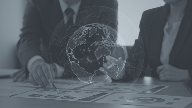 The concept of a group of business people meeting and a global network.