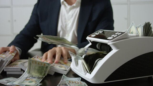 Businessman at office desk with money counting machine. Finance expert. Banker money counting in office. Banking process with cash. Business success with cash counting.