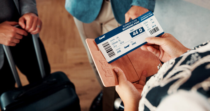 Travel, ticket and hands of business people in lobby with flight info for work trip to conference. Team, above and person with boarding pass, luggage and papers for journey, departure and schedule