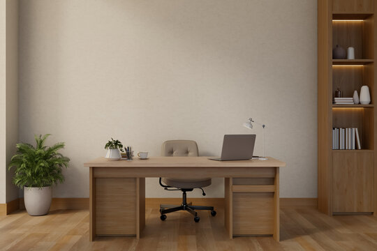 Laptop on counter table and swivel chair on wooden floor and bookshelf in white wall private office.