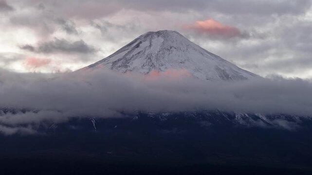 Volcano peak above clouds at sunrise, Chile