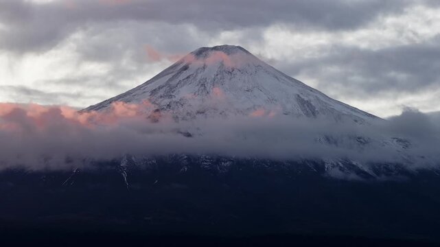 Volcano peak above clouds at sunrise, Chile
