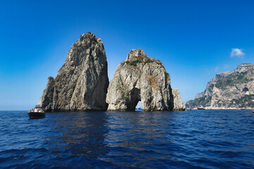Naklejka premium Sunny day at the iconic Faraglioni rocks of Capri