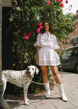 dalmatian dog on the leash near owner on the street in Amsterdam