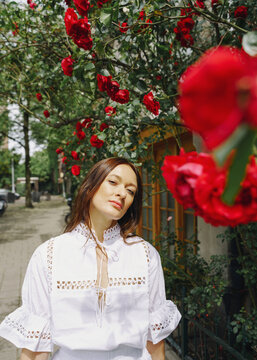 young woman in an elegant white dress on the street in Amsterdam city