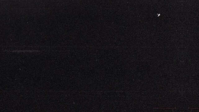 Authentic black and white dust, grain.Vintage film noise overlay.Grunge footage with lines and dust,Old tv noise effect filter texture.