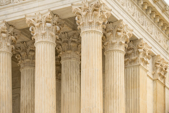 Columns stone architectural perspective symmetry. Columns marble fluted repetition. Columns decorative capitals carved detail. Columns classical heritage design.