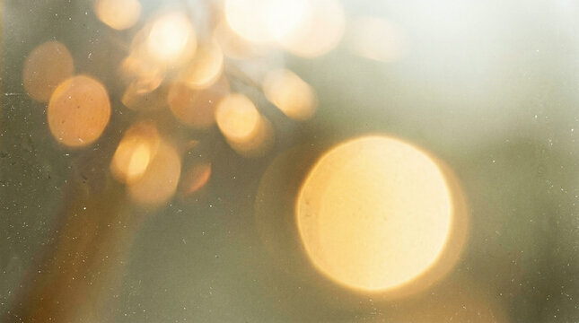 Blurry bokeh lights on a foggy window with raindrops