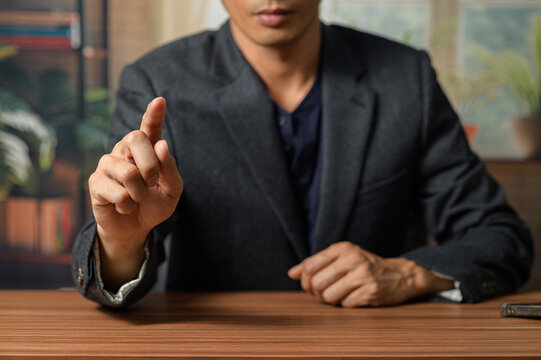 Businessman Presenting Gesture in Modern Office Setting