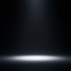 Obraz premium Minimalist dark studio background featuring a single vertical white spotlight beam shining from above onto an empty floor surface, creating a dramatic circular glow for product placement.
