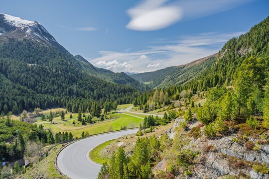 Scenic Winding Mountain Road in K&uuml;htai Valley, Alpine Pass Road Through Lush Green Landscape, Travel and Road Trip Concept in Tyrolean Alps Austria