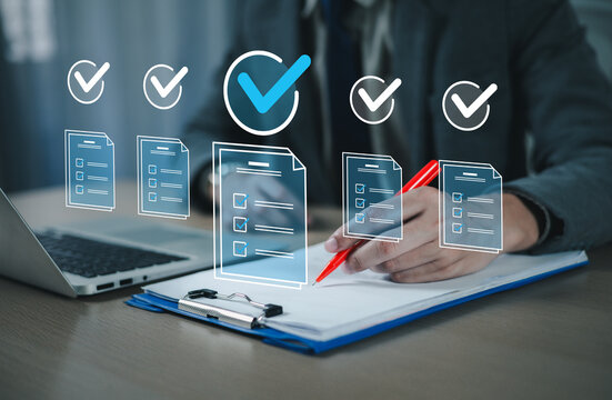 Business professionals use laptop computers to manage tasks and monitor work processes, including approval and processing. Automated request submission process; checkmark icon.