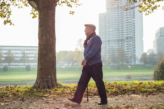 Senior man walking by the riverside
