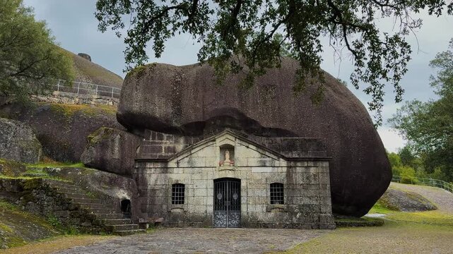 Santuario de Nossa Senhora da Lapa chapel built under a giant boulder in Soutelo, Portugal