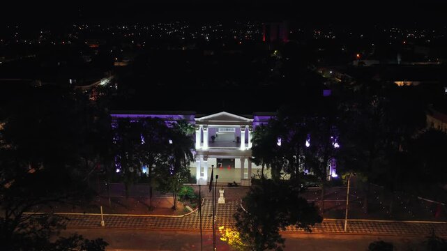 City hall of Villarica, Paraguay illuminated at night, symbolizing local authority and public services in a community