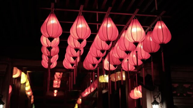 Red lanterns illuminating a dark street at night. Traditional vietnamese decoration for celebrating the lunar new year