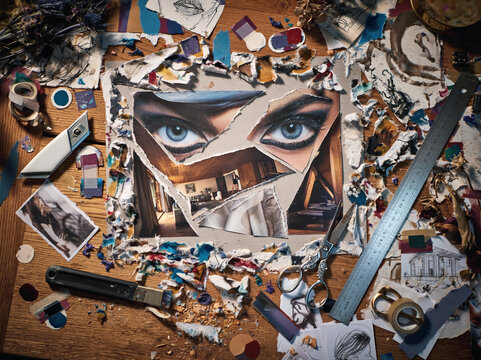 Collage making desk with scissors photos and art supplies flatlay
