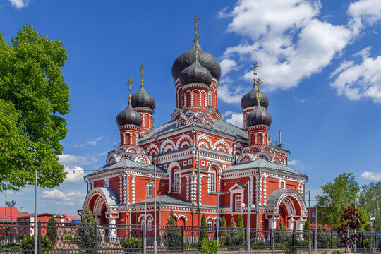 Holy Resurrection Cathedral in Borisov, Belarus three quarter view. Sunny sky over red brick orthodox church monument