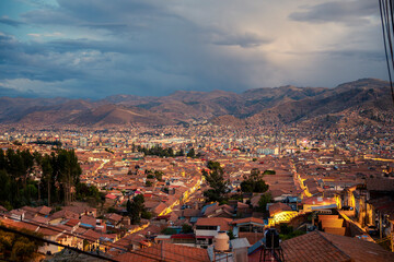 Panoramic blue hour view of Cusco city lights from Sacsayhuaman viewpoint, Peru © Helard