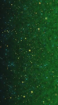 A mesmerizing abstract background featuring a deep green nebula with a scattering of bright golden stars and particles.