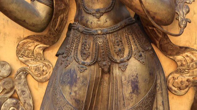 budhdha in stending pose with multiple heads idol