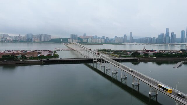 Fly along Governador Nobre de Carvalho Bridge in Macau, gloomy day