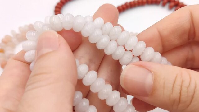 These strands of smooth white rondelle beads feature a polished and consistent finish, ideal for creating elegant necklaces, bracelets, and sophisticated jewelry accessories