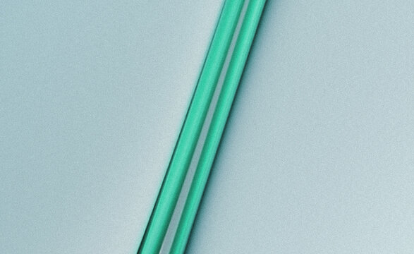 Two clear plastic drinking straws