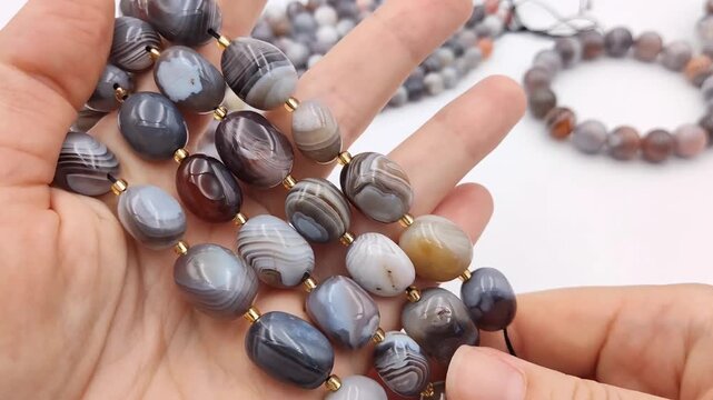 These sophisticated strands feature smooth oval banded agate stones interspersed with elegant gold spacer beads for high quality jewelry making and unique artisan accessory crafting projects