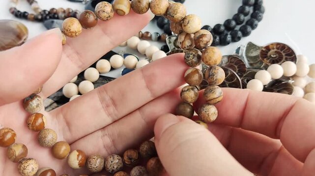 These polished round jasper beads showcase earthy tones and unique organic patterns for professional jewelry making and sophisticated artisan craft projects