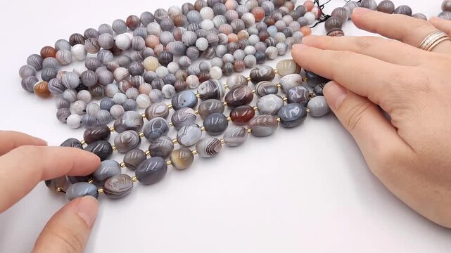 These sophisticated strands feature smooth oval banded agate stones interspersed with elegant gold spacer beads for high quality jewelry making and unique artisan accessory crafting projects