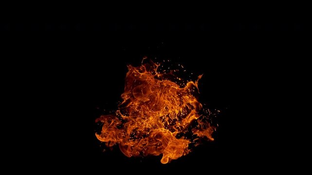 Small fire explosion with glowing sparks and embers isolated on a black background. Dynamic flames and combustion effects captured in high detail for dramatic visual impact.