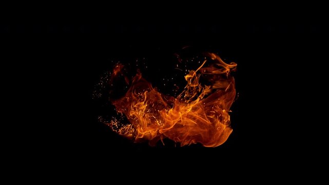 Small fire explosion with glowing sparks and embers isolated on a black background. Dynamic flames and combustion effects captured in high detail for dramatic visual impact.