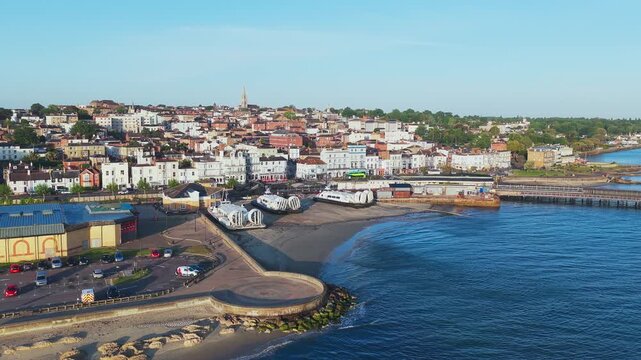 Morning panoramic view of Ryde Seafront on the Isle of Wight, featuring the town waterfront, railway station and hovercraft terminal during summer conditions.