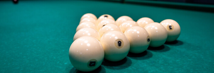 White billiard balls arranged on a pool table, emphasizing cue sport equipment, precision gameplay, clean design, and recreational indoor gaming atmosphere. © Daniel