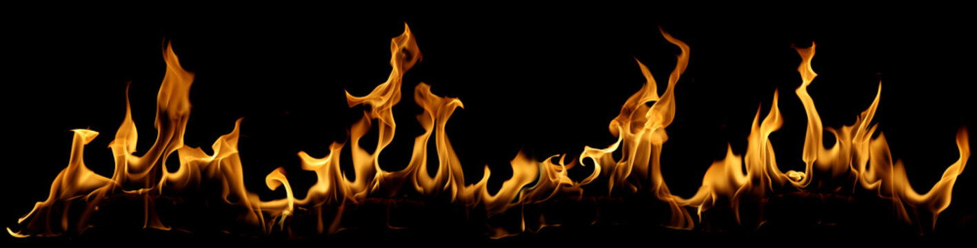 Realistic blazing fire flames isolated on black background, featuring intense heat, burning energy, wildfire texture and dramatic flame patterns for design, overlays, visual effects and safety concept